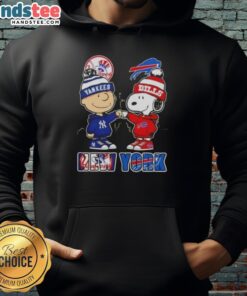 Charlie Brown fist bump with Snoopy, NYC skyline, Yankees and Buffalo Bills hoodie - perfect for sports fans.