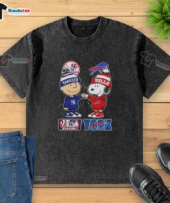 Alt Text: Official Charlie Brown fist bump with Snoopy, Yankees, and Buffalo Bills skyline on a washed t-shirt design.
