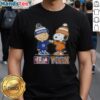 Official Charlie Brown fist bump with Snoopy on Yankees X Knicks T-shirt, perfect for NYC sports fans.