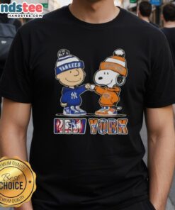 Official Charlie Brown fist bump with Snoopy on Yankees X Knicks T-shirt, perfect for NYC sports fans.
