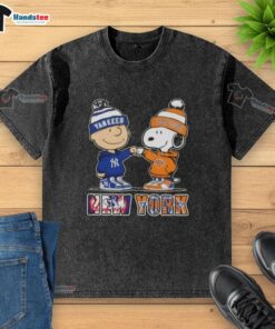 Alt Text: Official Charlie Brown fist bump with Snoopy on a washed t-shirt featuring New York City Yankees and Knicks sports logos.