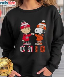 Official Charlie Brown fist bump with Snoopy on Ohio City sports sweatshirt featuring Buckeyes and Cleveland Browns design.