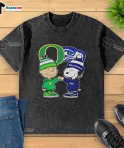 Official Charlie Brown fist bump with Snoopy on Oregon Ducks x Seattle Seahawks washed t-shirt, perfect for fans.