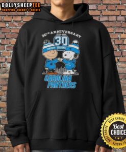 Alt Text: Official Charlie Brown X Snoopy 30th Anniversary hoodie featuring Carolina Panthers skyline design, 1995-2025.