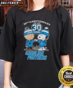 Alt Text: Official Charlie Brown X Snoopy 30th Anniversary Tee for Carolina Panthers with skyline design, womens fit.