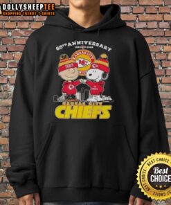 Alt Text: Official Charlie Brown X Snoopy 66th Anniversary hoodie featuring Kansas City Chiefs skyline design, 1960-2026.