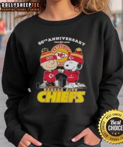 Alt Text: Official Charlie Brown X Snoopy 66th Anniversary sweatshirt featuring Kansas City Chiefs skyline design, 1960-2026.