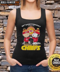Alt Text: Official Charlie Brown X Snoopy 66th Anniversary tank top featuring Kansas City Chiefs skyline design, 1960-2026.