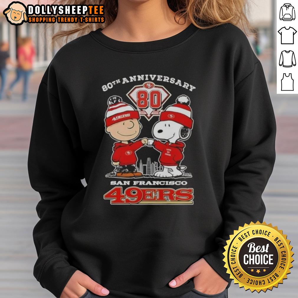 Official Charlie Brown X Snoopy 80th Anniversary 1946 2026 San Francisco 49ers Skyline Sweatshirt Alt Text: Official Charlie Brown x Snoopy 80th Anniversary sweatshirt featuring San Francisco 49ers skyline design, 1946-2026.