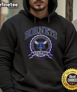 Alt Text: Official Charlotte Hornets NBA logo with laurel wreath frame on a retro hoodie, perfect for basketball fans.