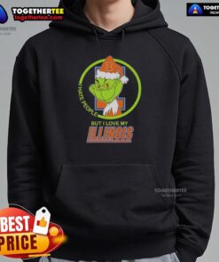 Official Grinch 'I Hate People But I Love My Illinois Fighting Illini Hoodie' featuring a festive design and logo.