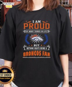 Official 'I Am Proud Of Many Things In Life' Denver Broncos Fan Ladies Tee in vibrant blue and orange colors.