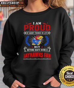 Kansas Jayhawks fan sweatshirt with 'I Am Proud Of Many Things In Life' slogan, perfect for loyal supporters.