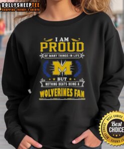 Michigan Wolverines fan sweatshirt with 'I Am Proud Of Many Things But Nothing Beats Being A Michigan Wolverines Fan' design.