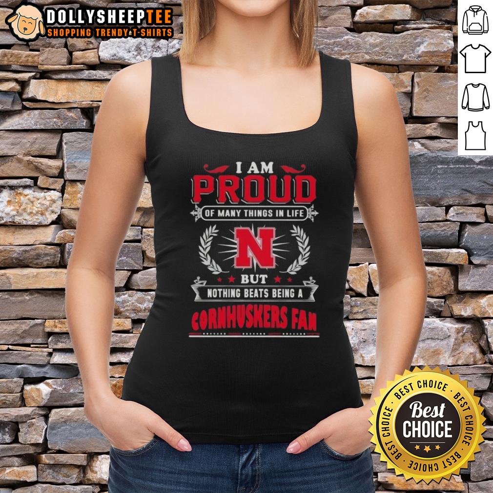 Official I Am Proud Of Many Things In Life But Nothing Beats Being A Nebraska Cornhuskers Fan Tank Top Alt Text: Nebraska Cornhuskers fan tank top with 'I Am Proud Of Many Things In Life' slogan, perfect for game day.