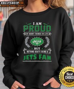 Official I Am Proud Of Many Things In Life But Nothing Beats Being A New York Jets Fan sweatshirt displayed on a hanger.