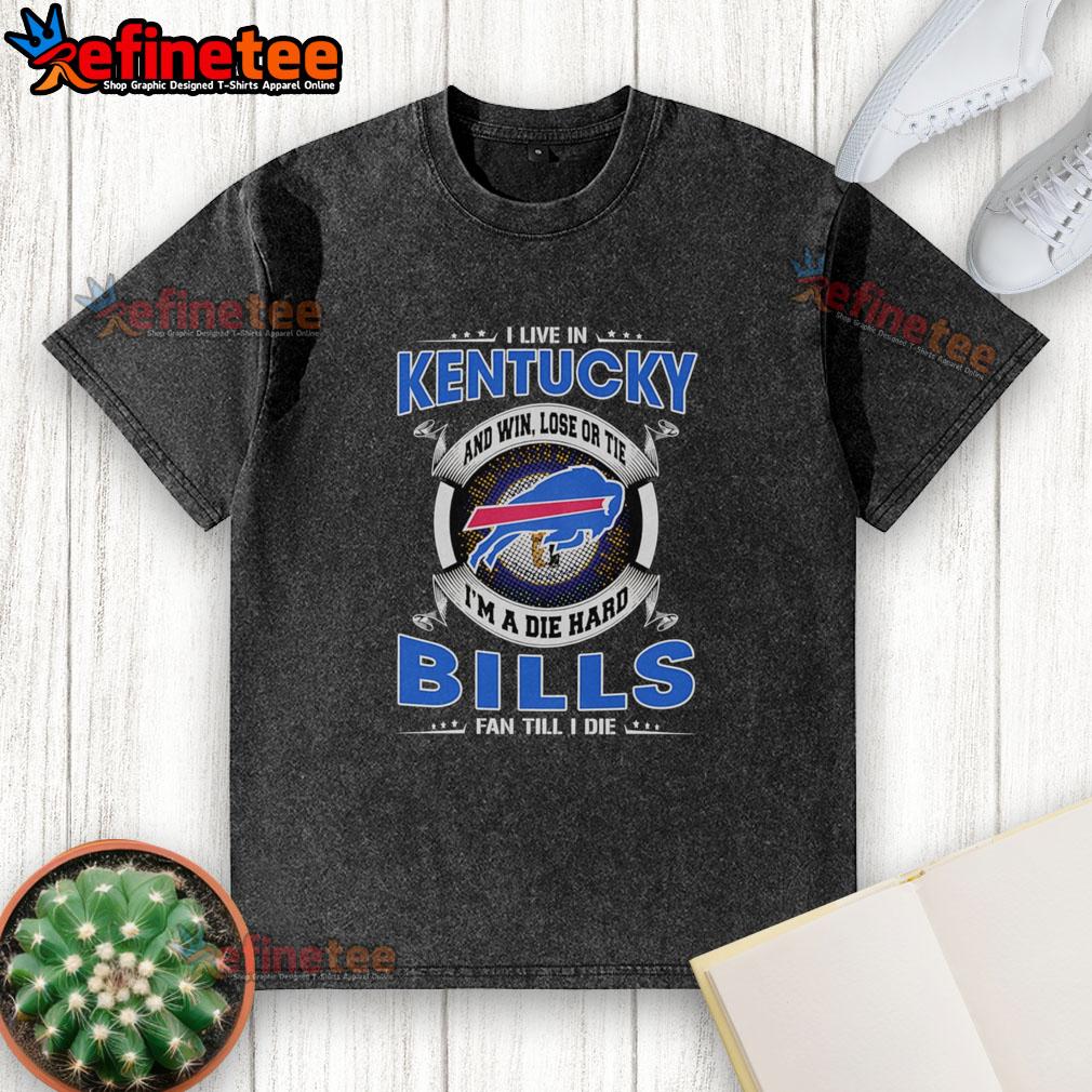 official-i-live-in-kentucky-and-win-lose-or-tie-im-a-dead-hard-buffalo-bills-fan-till-i-die-washed-t-shirt Alt Text: Kentucky fan wearing a washed Buffalo Bills t-shirt, showcasing loyalty with 'Win, Lose, or Tie, I'm a Bills Fan' slogan.