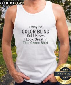 Man wearing a green tank top, playfully stating, I may be color blind, but I know I look green!