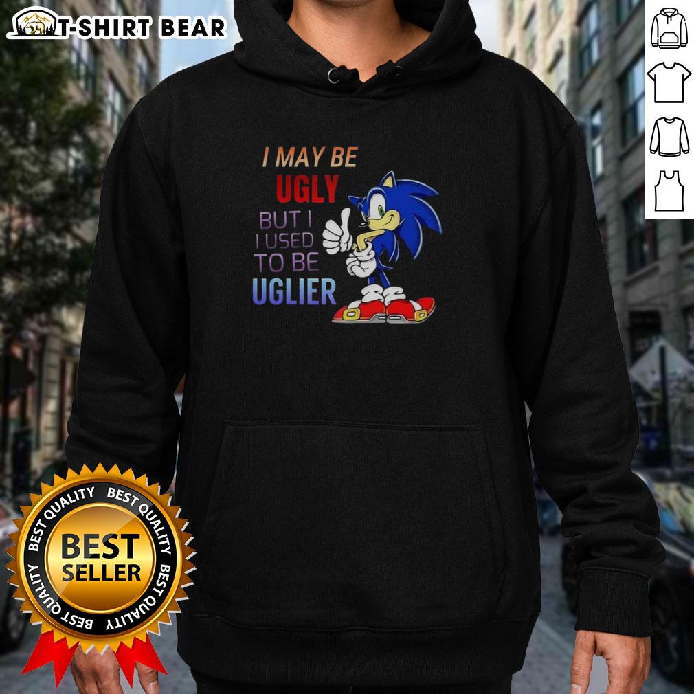 Official I May Be Ugly But I Used To Be Uglier Cartoon Hedgehog Hoodie Alt Text: Cartoon hedgehog hoodie featuring the phrase I May Be Ugly But I Used To Be Uglier in vibrant colors.