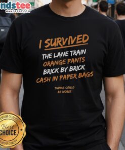 Alt Text: Official I Survived The Lane Train t-shirt in orange pants, featuring 'Brick By Brick Cash In' design for fans.