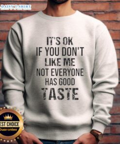 Official 'It's Ok If You Don't Like Me' sweatshirt featuring a bold quote design for a trendy, casual look.