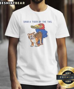 Official Kansas Jayhawks vs Missouri Tigers rivalry T-shirt featuring 'Grab A Tiger By The Tail' mascot design.