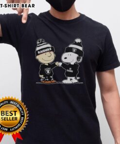 Alt Text: Official Los Angeles Raiders Snoopy and Charlie Brown Best Friends T-Shirt featuring iconic cartoon characters and team logo.