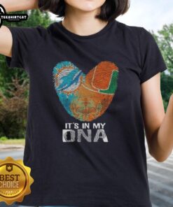 Official Miami City Sports Dolphins X Hurricanes ladies tee featuring 'It's In My DNA' design with heart and fingerprint.