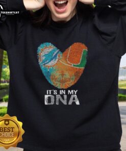 Alt Text: Official Miami City Sports Dolphins X Hurricanes sweatshirt featuring It's In My DNA graphic on heart design.