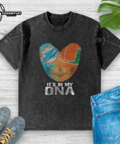 Alt Text: Official Miami City sports Dolphins x Hurricanes It's In My DNA fingerprint heart washed t-shirt design.