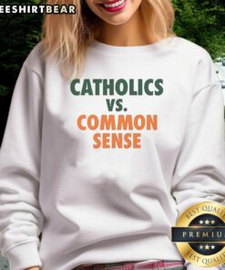 Official Miami Hurricanes sweatshirt featuring 'Catholics vs. Common Sense' design for fans and supporters.