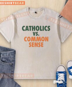 Alt Text: Official Miami Hurricanes Catholics Vs Common Sense Washed T-Shirt featuring vibrant team colors and graphic design.