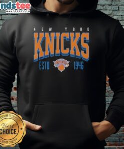 Alt Text: Official New York Knicks NBA Battle Tested hoodie, established 1946, showcasing team colors and logo design.