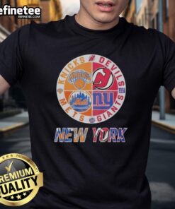 Alt Text: Official New York Knicks, Mets, Devils, Giants mashup logo t-shirt featuring iconic team logos and vibrant colors.