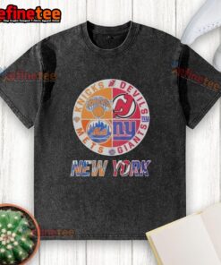 Alt Text: Official New York Knicks, Mets, Devils, Giants mashup logo on a washed t-shirt, perfect for sports fans.