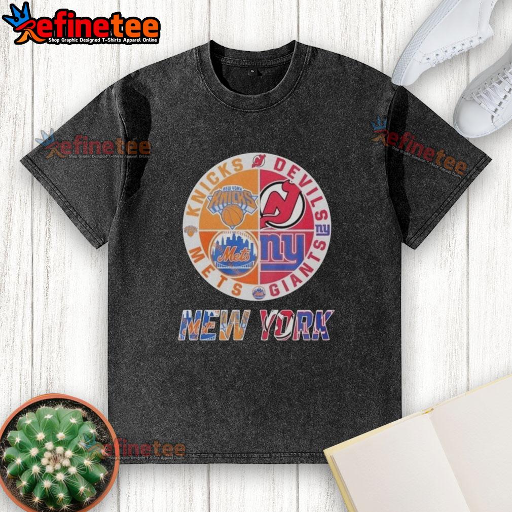 official-new-york-knicks-new-york-mets-new-jersey-devils-new-york-giants-mashup-logo-washed-t-shirt Alt Text: Official New York Knicks, Mets, Devils, Giants mashup logo on a washed t-shirt, perfect for sports fans.