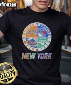Alt Text: Official New York Knicks, Mets, Jets, Rangers mashup logo t-shirt featuring iconic team logos in vibrant colors.