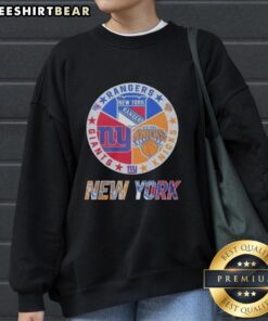 Alt Text: Official New York Rangers, Giants, and Knicks mashup logo sweatshirt featuring vibrant team colors and design.