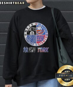 Official New York Yankees Brooklyn Nets Islanders Giants mashup logo sweatshirt featuring team logos and colors.