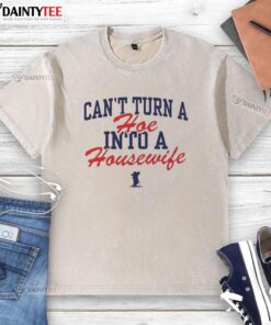 Official Ole Miss Rebels 'Can't Turn A Hoe Into A Housewife' washed t-shirt featuring bold graphic design and school colors.