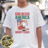 Official Peanuts God Bless America and Snoopy Claus T-Shirt featuring Snoopy in festive holiday attire, perfect for Christmas.