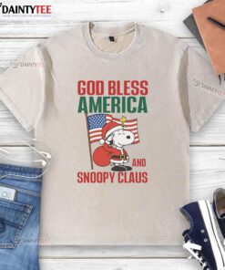 Official Peanuts God Bless America and Snoopy Claus washed t-shirt featuring festive Snoopy design for patriotic fans.