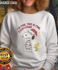 Alt Text: Official Peanuts Snoopy and Woodstock 'I'm Fine, This Is Fine' Christmas Lights Sweatshirt design featuring festive characters.