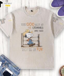 Official Peanuts Snoopy Cowboy T-shirt featuring 'When God Made Me He Grinned And Said This'll Be Fun' design.