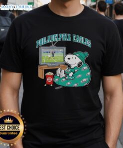 Official Philadelphia Eagles Snoopy Cozy Game Day T-Shirt in Peanuts style, perfect for fans and game day celebrations.
