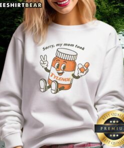 Alt Text: Cartoon sweatshirt with the phrase Please Be Patient, Sorry My Mom Took Tylenol in colorful lettering.