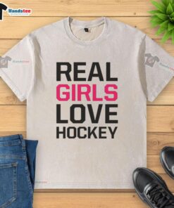 Official Real Girls Love Hockey washed t-shirt in soft fabric, featuring a stylish hockey-themed graphic for fans.