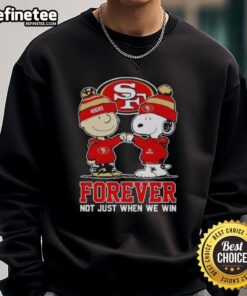 Alt Text: Official San Francisco 49ers X Charlie Brown sweatshirt featuring Snoopy with 'Forever, Not Just When We Win' design.