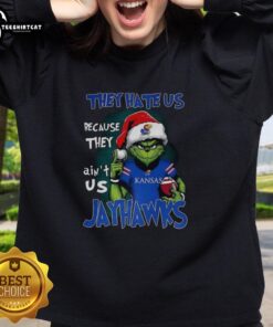 Official Santa Grinch sweatshirt featuring 'They Hate Us Because They Ain't Us' for Kansas Jayhawks fans.