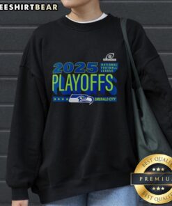 Alt Text: Official Seattle Seahawks 2025 NFL Playoffs Emerald City sweatshirt featuring team logo and vibrant colors.